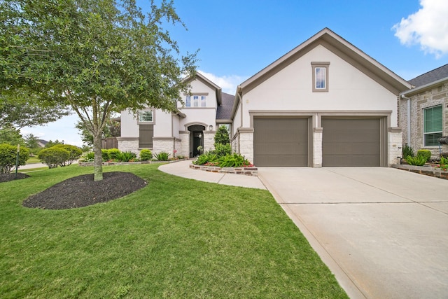 13305 Newcastle Creek Ct, Houston, TX 77059 - view of front facade with stucco siding, a garage, driveway, a front lawn, and stone siding