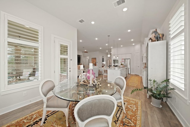 13305 Newcastle Creek Ct, Houston, TX 77059 - dining space featuring light wood-type flooring and recessed lighting