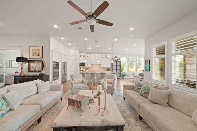 13305 Newcastle Creek Ct, Houston, TX 77059 - living area featuring a ceiling fan, recessed lighting, and light wood-style floors