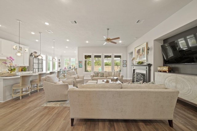 13305 Newcastle Creek Ct, Houston, TX 77059 - living area with ceiling fan, recessed lighting, wood finished floors, and a fireplace