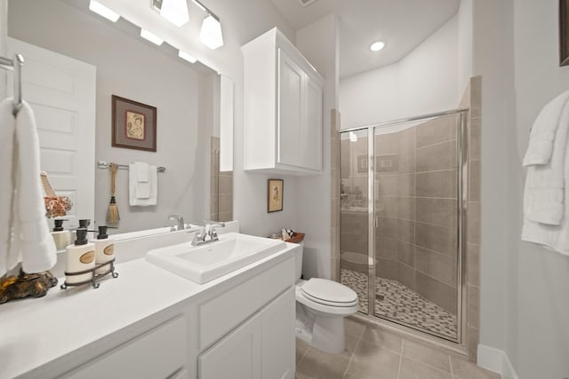 13305 Newcastle Creek Ct, Houston, TX 77059 - bathroom with vanity, a stall shower, tile patterned flooring, and recessed lighting