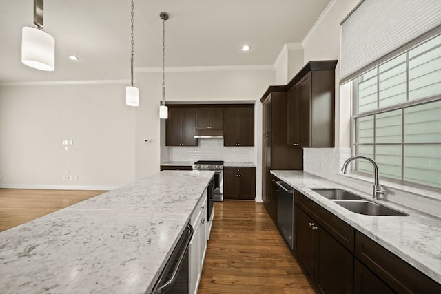 1034 W 26th St Unit D, Houston, TX 77008 - kitchen with appliances with stainless steel finishes, ornamental molding, backsplash, dark brown cabinets, and light stone counters