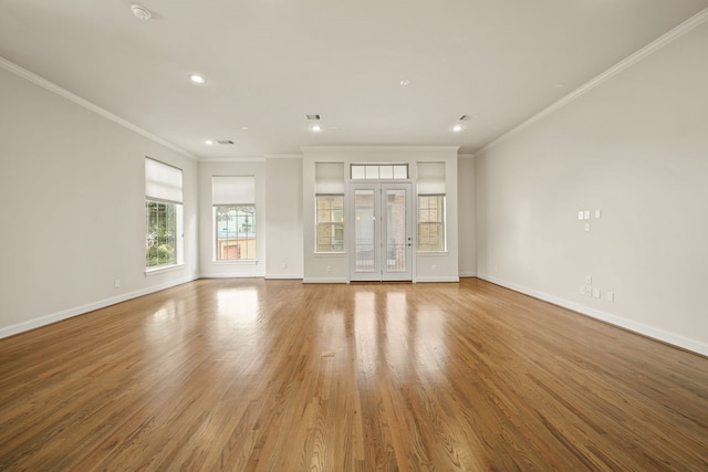 1034 W 26th St Unit D, Houston, TX 77008 - unfurnished living room featuring crown molding, wood finished floors, and recessed lighting