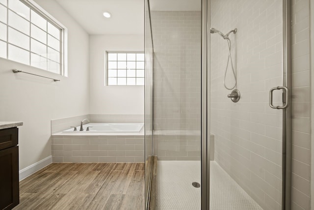 1034 W 26th St Unit D, Houston, TX 77008 - full bathroom with vanity, wood finished floors, a garden tub, and a shower stall