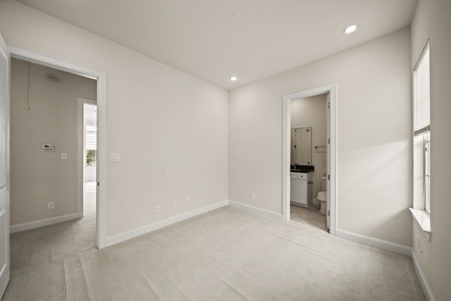 1034 W 26th St Unit D, Houston, TX 77008 - unfurnished bedroom featuring light carpet, recessed lighting, and connected bathroom