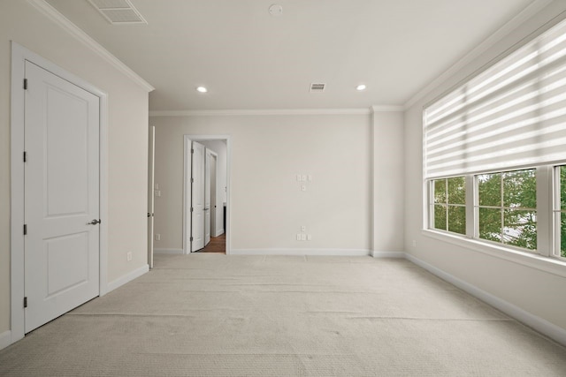 1034 W 26th St Unit D, Houston, TX 77008 - unfurnished room with light carpet, crown molding, and recessed lighting