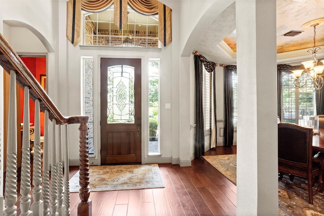 12902 Tamarack Bend Ln, Humble, TX 77346 - foyer with arched walkways, a chandelier, and healthy amount of natural light