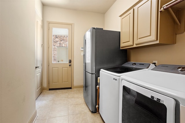 12902 Tamarack Bend Ln, Humble, TX 77346 - laundry area with cabinet space, separate washer and dryer, and light tile patterned floors