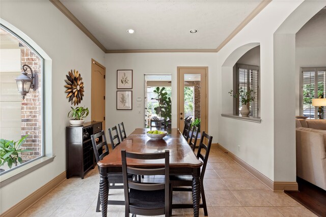 12902 Tamarack Bend Ln, Humble, TX 77346 - dining room featuring light tile patterned floors and ornamental molding