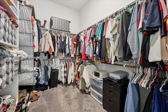 9111 Regan Way, Mont Belvieu, TX 77523 - walk in closet featuring carpet