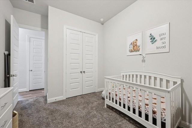 9111 Regan Way, Mont Belvieu, TX 77523 - carpeted bedroom with a closet and a nursery area