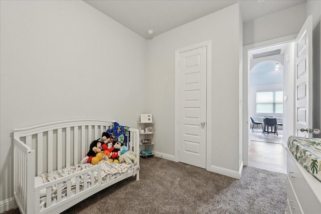 9111 Regan Way, Mont Belvieu, TX 77523 - bedroom with carpet floors and a crib