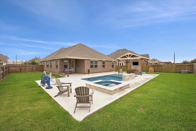 9111 Regan Way, Mont Belvieu, TX 77523 - view of pool featuring a patio, a fenced backyard, and a pool with connected hot tub