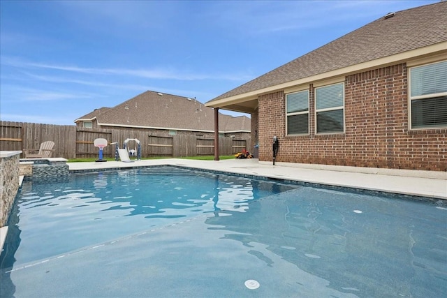 9111 Regan Way, Mont Belvieu, TX 77523 - view of pool featuring a fenced backyard and a pool with connected hot tub