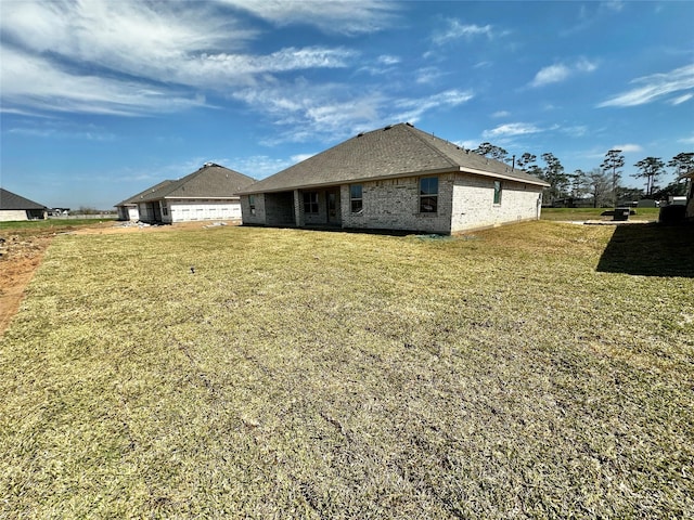 4314 Karam Lndg, Dickinson, TX 77539 - rear view of house featuring a yard and brick siding