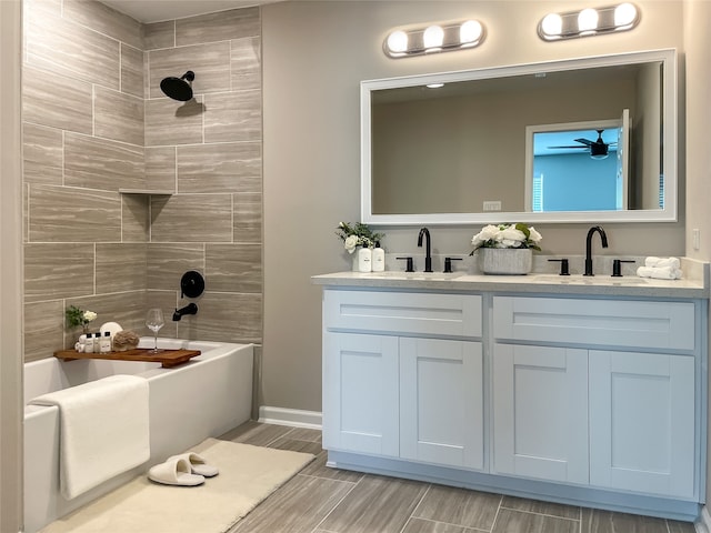 8832 Curry Rd, Houston, TX 77093 - bathroom featuring double vanity,  shower combination, and wood tiled floors
