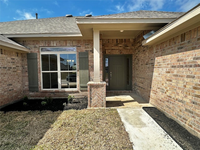 4318 Karam Lndg, Dickinson, TX 77539 - property entrance featuring a shingled roof and brick siding