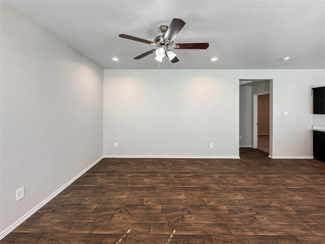 14047 Thunder Pines Dr, Conroe, TX 77302 - empty room with dark wood finished floors, ceiling fan, and recessed lighting