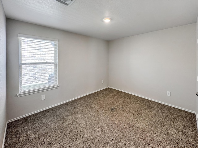 14047 Thunder Pines Dr, Conroe, TX 77302 - empty room featuring dark carpet and baseboards
