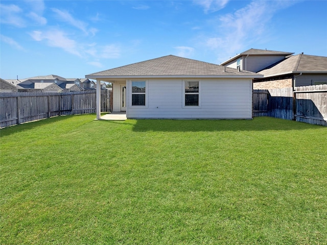 14047 Thunder Pines Dr, Conroe, TX 77302 - back of property featuring a fenced backyard, roof with shingles, and a patio area