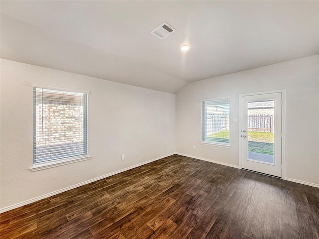 14127 Carly Pines Ct, Conroe, TX 77302 - spare room with vaulted ceiling and dark wood finished floors