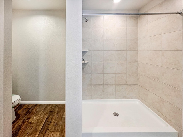 14127 Carly Pines Ct, Conroe, TX 77302 - bathroom featuring wood finished floors and a tile shower