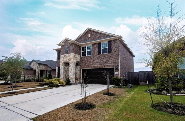 11215 Pavonia Creek Ct, Richmond, TX 77406 - view of front of house with brick siding, an attached garage, and driveway