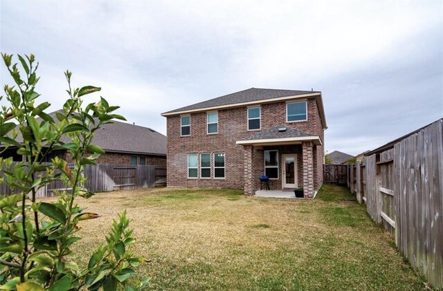11215 Pavonia Creek Ct, Richmond, TX 77406 - back of house featuring a fenced backyard, a patio area, and brick siding