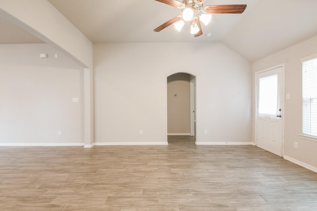 2233 Garden Square Path, Spring, TX 77386 - spare room featuring arched walkways, a ceiling fan, light wood-style floors, and lofted ceiling