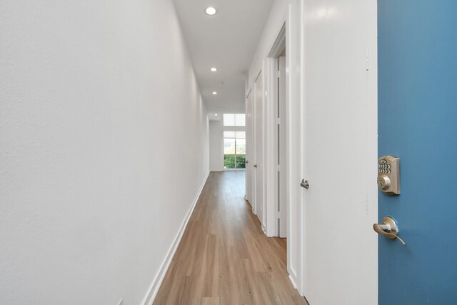 207 Pierce St Unit 301, Houston, TX 77002 - corridor featuring light wood-type flooring and recessed lighting