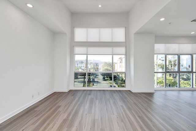 207 Pierce St Unit 301, Houston, TX 77002 - unfurnished room featuring wood finished floors and recessed lighting