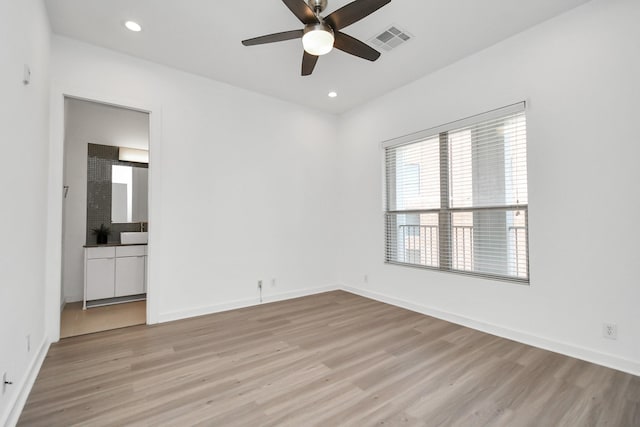 207 Pierce St Unit 301, Houston, TX 77002 - empty room featuring light wood-type flooring, a ceiling fan, and recessed lighting