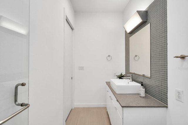 207 Pierce St Unit 301, Houston, TX 77002 - bathroom with vanity and tasteful backsplash
