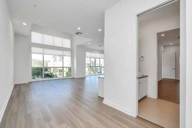 207 Pierce St Unit 301, Houston, TX 77002 - unfurnished room with light wood-style floors and recessed lighting