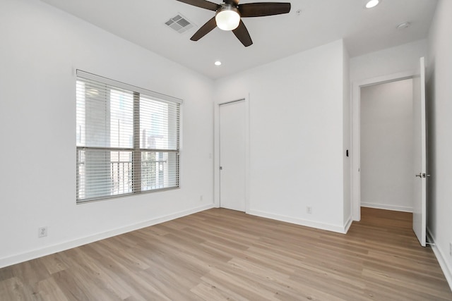 207 Pierce St Unit 301, Houston, TX 77002 - unfurnished bedroom featuring light wood-style floors, recessed lighting, a closet, and a ceiling fan