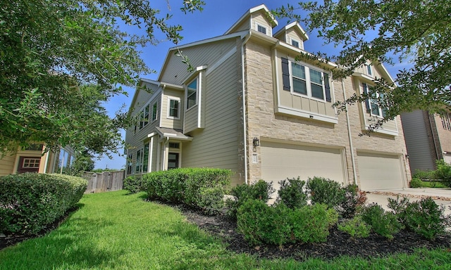 239 Biltmore Loop, Montgomery, TX 77316 - view of side of home featuring stone siding, a garage, board and batten siding, and driveway