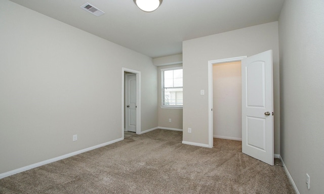 239 Biltmore Loop, Montgomery, TX 77316 - unfurnished bedroom featuring carpet and baseboards