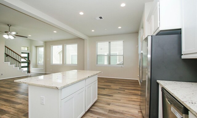 239 Biltmore Loop, Montgomery, TX 77316 - kitchen featuring stainless steel appliances, dark wood-style flooring, white cabinetry, a center island, and recessed lighting