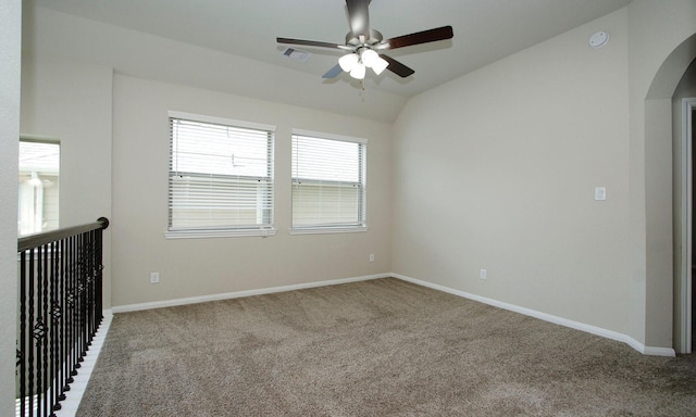239 Biltmore Loop, Montgomery, TX 77316 - carpeted spare room featuring lofted ceiling, a ceiling fan, arched walkways, and a smoke detector