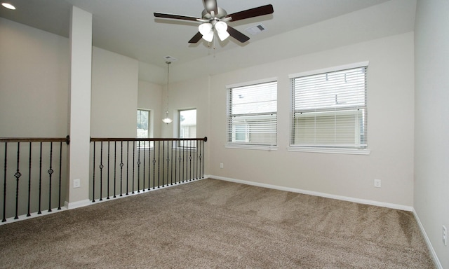 239 Biltmore Loop, Montgomery, TX 77316 - spare room featuring ceiling fan and carpet floors
