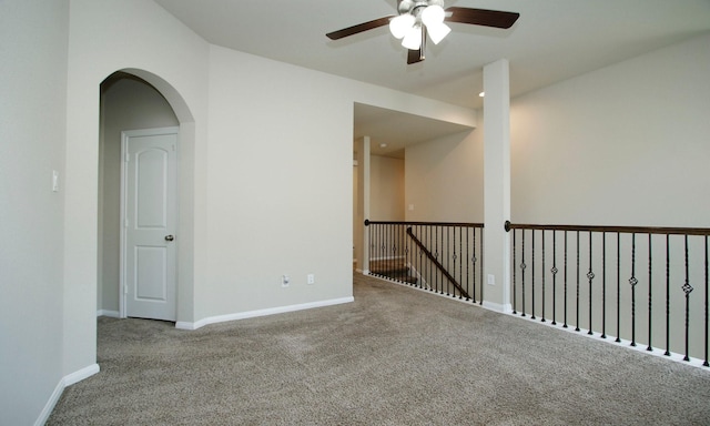 239 Biltmore Loop, Montgomery, TX 77316 - carpeted empty room with ceiling fan and arched walkways