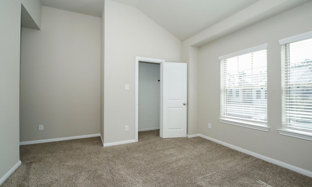 239 Biltmore Loop, Montgomery, TX 77316 - unfurnished bedroom featuring lofted ceiling and carpet