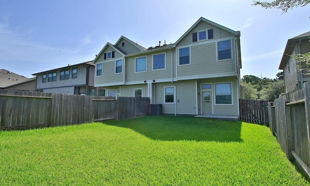 239 Biltmore Loop, Montgomery, TX 77316 - rear view of house featuring a fenced backyard and board and batten siding