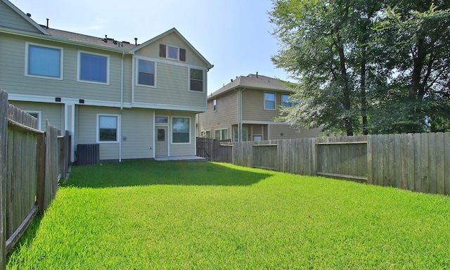 239 Biltmore Loop, Montgomery, TX 77316 - back of house with a fenced backyard