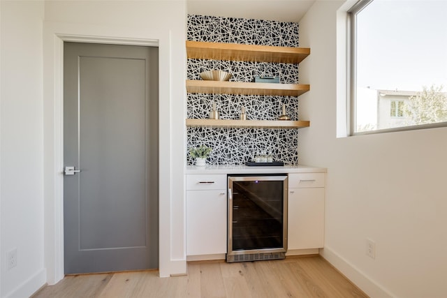 1609 Park St, Houston, TX 77019 - indoor dry bar with beverage cooler and light wood-type flooring