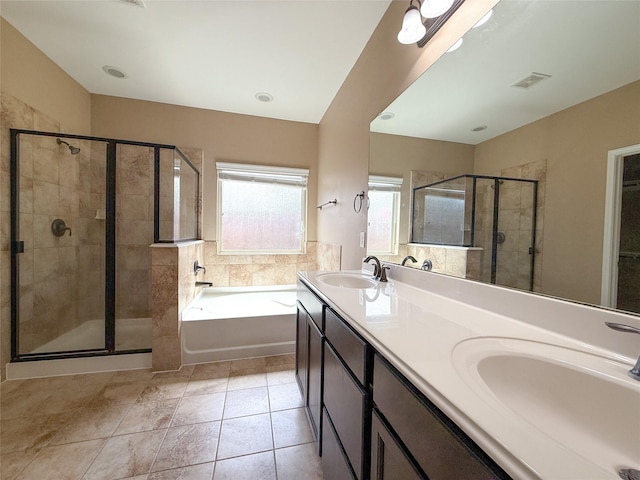 18227 Dusty Terrace Ln, Katy, TX 77449 - bathroom featuring a bath, a stall shower, double vanity, and tile patterned flooring