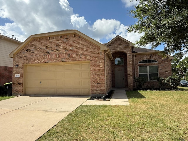 18227 Dusty Terrace Ln, Katy, TX 77449 - traditional home with brick siding, a garage, a front lawn, and concrete driveway