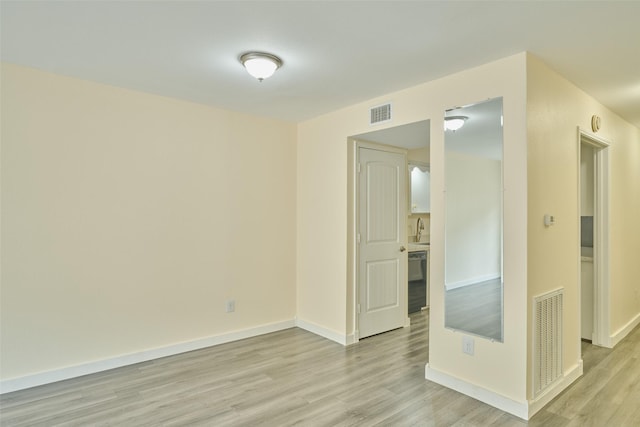 2308 Winrock Blvd Unit 173, Houston, TX 77057 - unfurnished room with light wood-style floors and baseboards