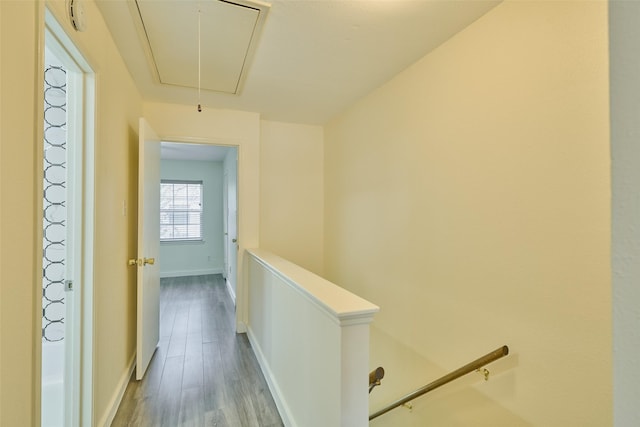 2308 Winrock Blvd Unit 173, Houston, TX 77057 - hallway with attic access, an upstairs landing, and wood finished floors