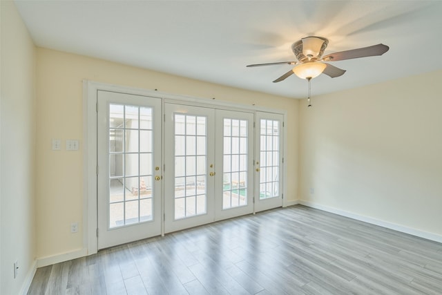 2308 Winrock Blvd Unit 173, Houston, TX 77057 - spare room featuring french doors, wood finished floors, and ceiling fan